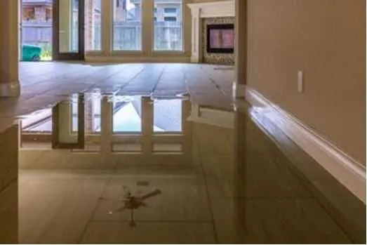 Finished basement living area with level floor and structural repair wall after stabilization