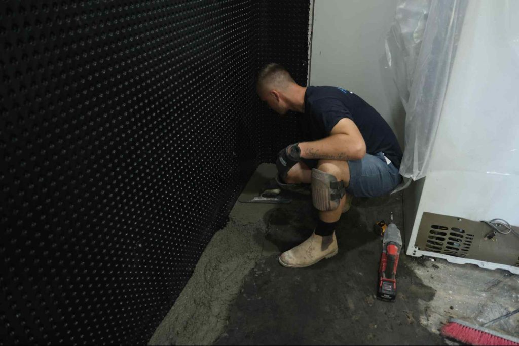 aquatech waterproofing worker membrane crawlspace corner 01