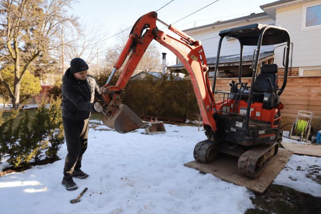 aquatech waterproofing worker mini excavator snow 01